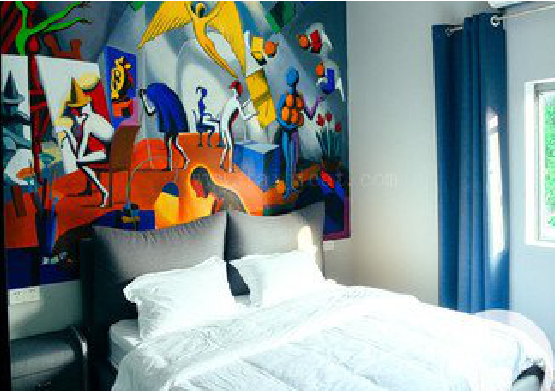 古田对于酒店的墙体彩绘而言更注重哪些方面？